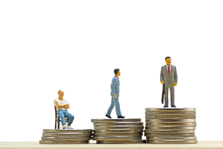 Concept, Miniature  business people on step of coin money, On a white backgroundの写真素材
