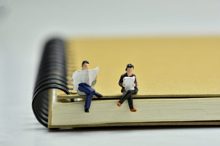 Concept, Read a book on a notebook, Men and women sit and read.