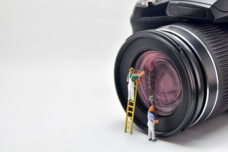 Minifigure Concept, cleaner Cleaning the lens of the camera.の写真素材