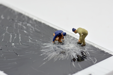 Concept, Repair Team, Phone Screen Repair, On a white backgroundの写真素材