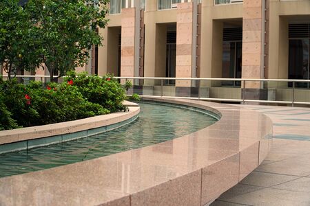 Water fontain near the office buildingの写真素材