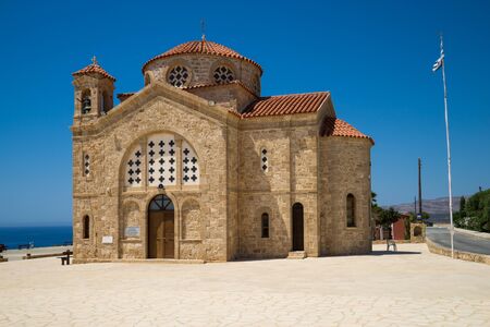 Stone church Agios Georgios with blue sky, Cyprusの写真素材