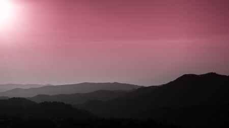 Troodos mountains, Cyprus, silhouette of the mountains at pink sunsetの写真素材
