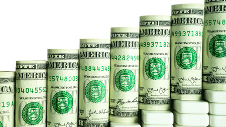 Rolled dollar banknote with white background, isolated money staircaseの写真素材