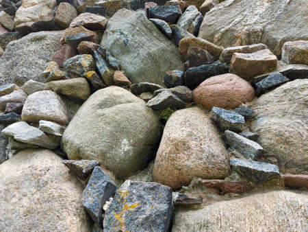 a very old medieval church wall with granite stoneの写真素材