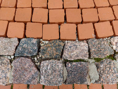 Save Download Preview The texture of the paved tile on the bottom of the street. Natural brick squared stone floor background. Colorful paving slabs. Paving slabsの写真素材