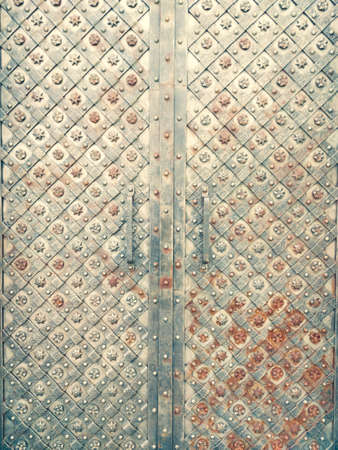 old monastery metal door with ornamentの写真素材