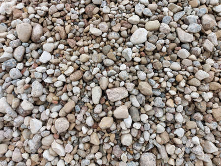 Multi-colored pebbles, medium-sized stones. Close-up view from above.の写真素材