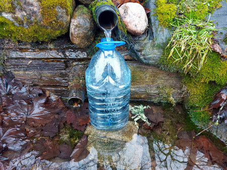 Cold plastic bottle of water. drought, thirst, hydration, natural resource conservation and recycling concept.の写真素材