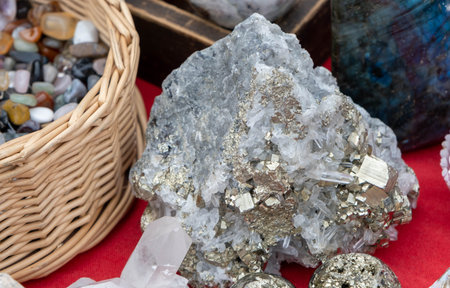 Close-up of clasters of pyrite and quartz crystals background. Texture of crystals of pyrite. Raw...