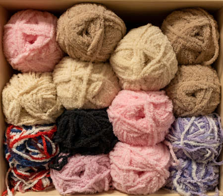 Close up of yarn balls. rainbow colors. Yarn for knitting. Skins of yarn. Knitting needles, colorful threads. Knitting background, Knitting yarn for handmade winter clothesの写真素材