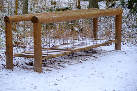 Children's recreation, dexterity attraction in winter. A snow-covered facility. Recreational nature...