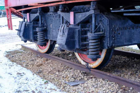 Old steam locomotive wheel and connecting rods. Tie rod or side rod for drive wheels. A retro...