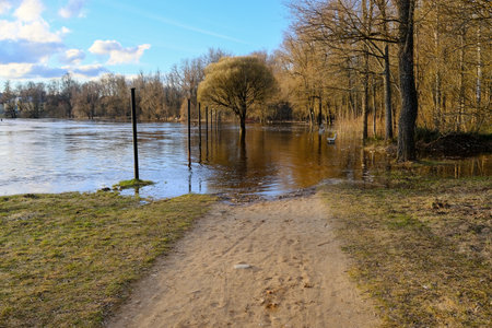 Early spring in Valmiera. Gauja river flooded. Nature in Europe early spring. The river has overflowed its banksの写真素材