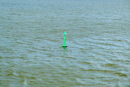 Fairway with green buoy in a sea. Safe movement at sea, navigationの写真素材