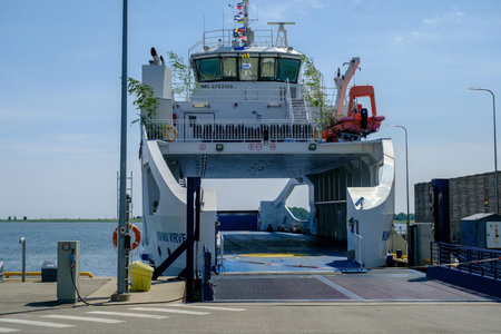 Munalaiu, Estonia - June 23, 2023: Passenger ferry at harbor pier in summer. Concept of transportation, ferries, shipping and travelのeditorial素材