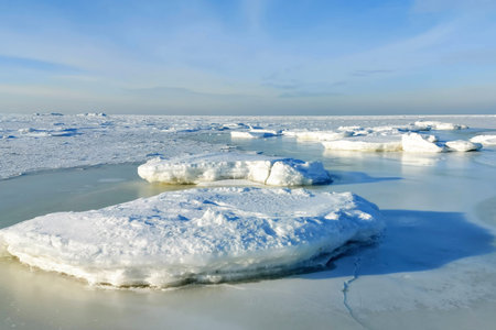 The Baltic Sea The Gulf of Riga in winter. The bay is covered with ice with small pieces of ice....