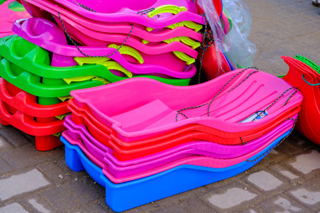 Background of the colorful sides of plastic sledsの写真素材