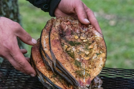 A Rustic Outdoor Setting with Freshly Grilled Fish.