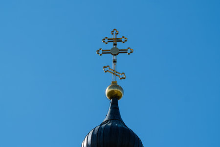 Ornate Church Cross Against Clear Blue Skyの写真素材