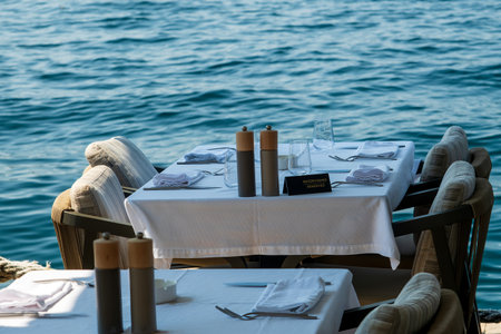 Reserved seaside dining table with ocean viewの写真素材