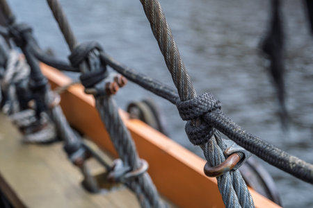 Close up of rope on a wooden deck of an old sailing boat