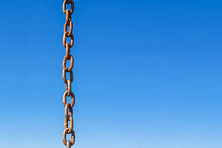 Chain on a blue sky background.の写真素材