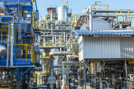 Part of a gas processing plant against the blue sky in summer.