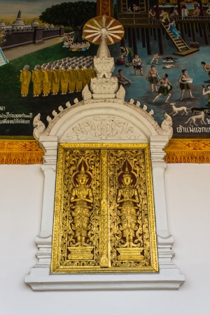 Golden Ornament wooden window of Thai temple in Lamphun, Thailandの写真素材