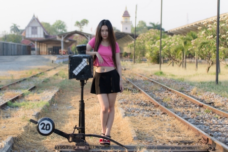 Portrait of a beautiful Thai woman smiling on train station platformの写真素材