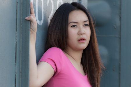 Portrait of a beautiful Thai woman smiling on train station platformの写真素材