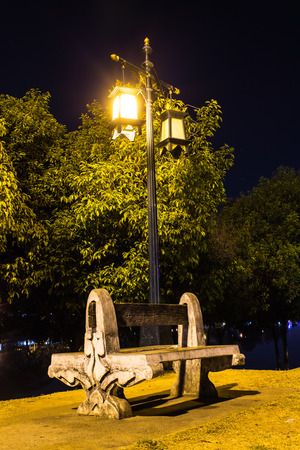 Park at night near riverの写真素材