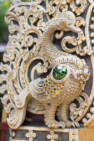 White Swan statue on the wall in Thai templesの写真素材