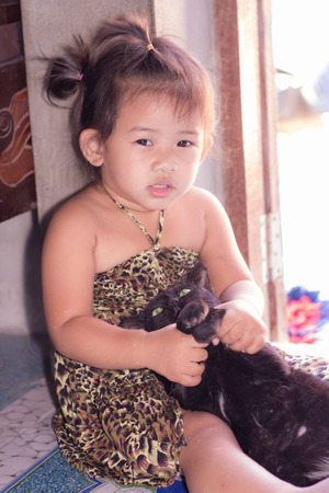 Thai girl with black catの写真素材