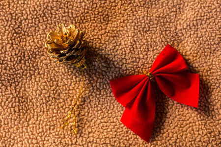 Pine cones with bow on fabric christmas still lifeの写真素材