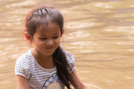 asia girl in riverの写真素材