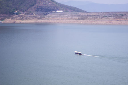 Ship sailing at Mae Ngad dam in Chiangmai Thailandの写真素材
