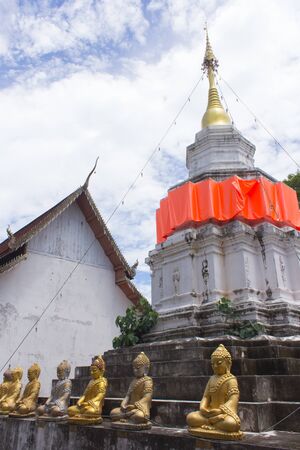 Old Thai white pagoda in wat Kamaed, Chiangmai Thailandの写真素材