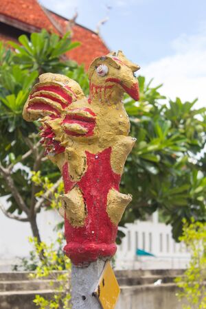 Golden chicken statue in Thai templeの写真素材