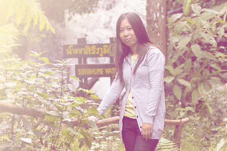Portrait Thai woman at siribhum waterfall doi inthanon national park, Chiangmai Thailandの写真素材