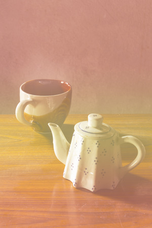 still life classic ceramic kettle with cupの写真素材