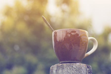 Ceramic coffee cup with bokehの写真素材