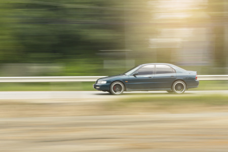 Green Car panning speed on road, Thailand asiaの写真素材