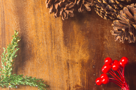 Pine cones red  bead pine needles on wood christmas still life backgroundの写真素材
