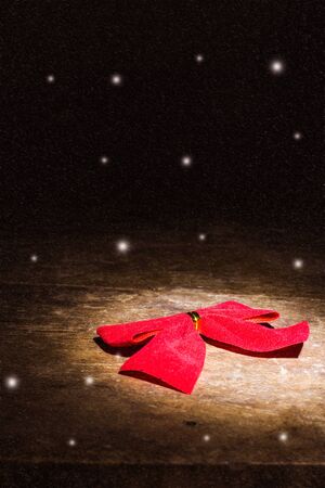 red bow still life with snowの写真素材
