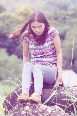 Thai Woman Enjoy on The rock in Field Doi inthanon, Maeglangluang Karen villagesの写真素材