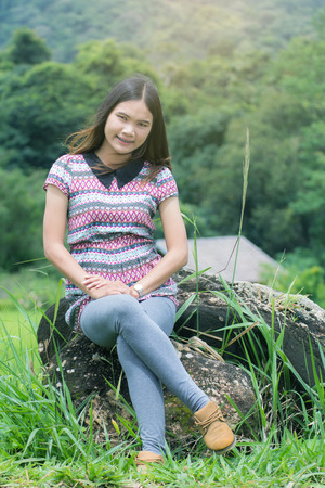 Thai Woman Enjoy on The rock in Field Doi inthanon, Maeglangluang Karen villagesの写真素材