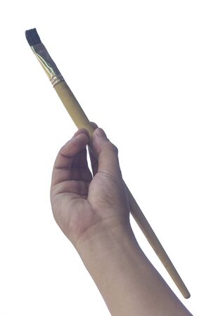 hand hold paintbrush isolated on a whiteの写真素材