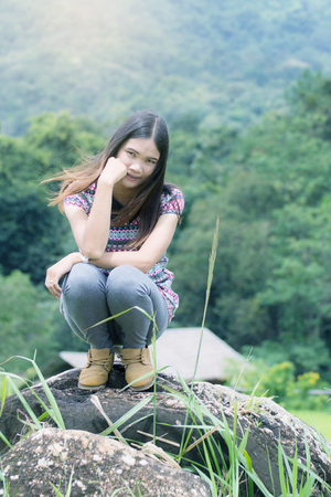 Thai Woman Enjoy on The rock in Field Doi inthanon, Maeglangluang Karen villagesの写真素材