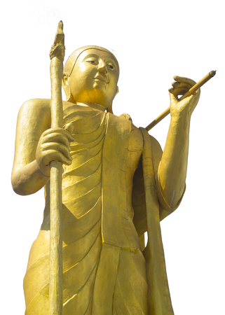 golden thai monk statue Isolated on whiteの写真素材